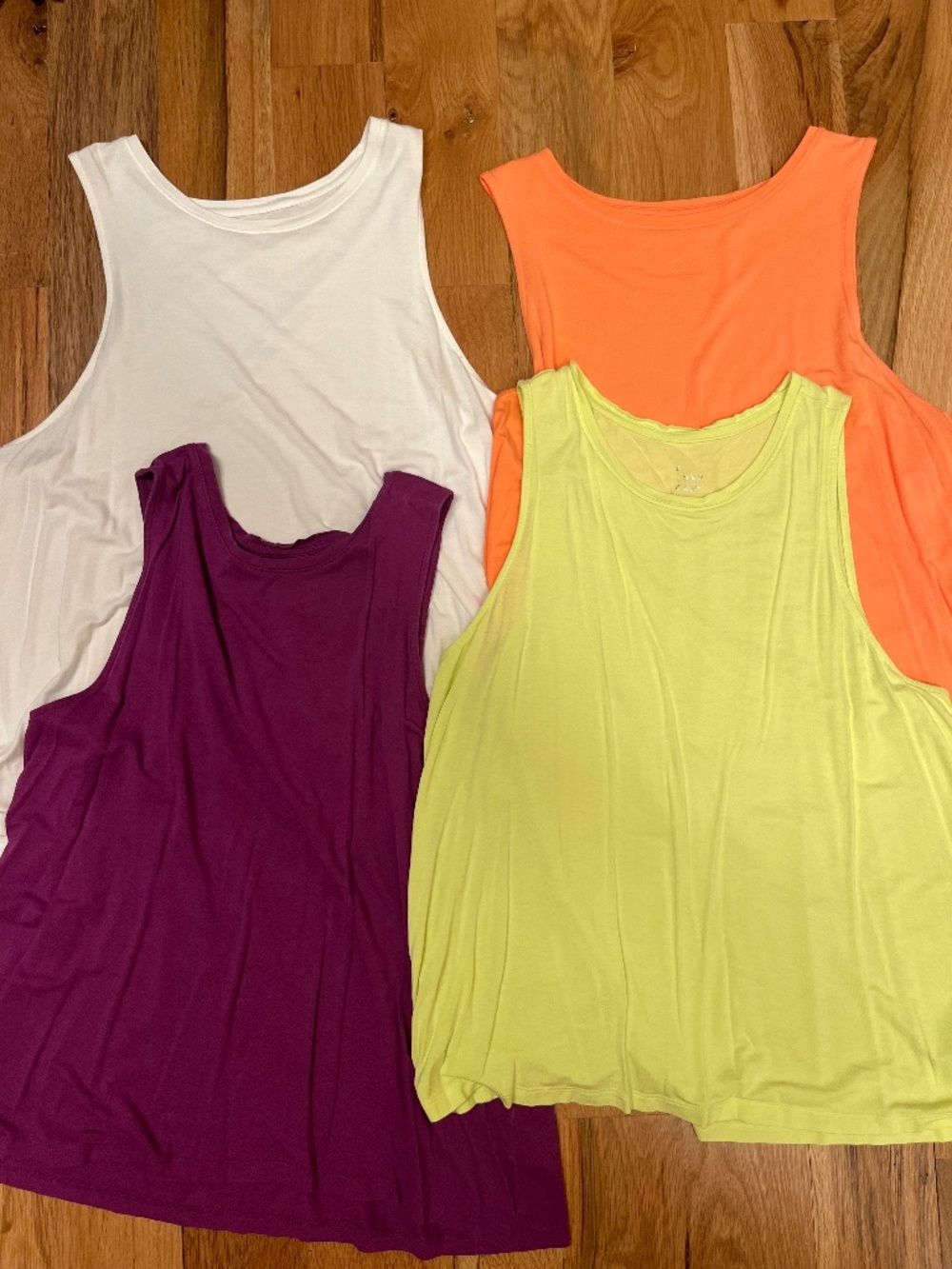 4 a new day tank tops